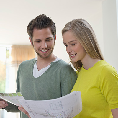 A couple studying their home renovation plan together