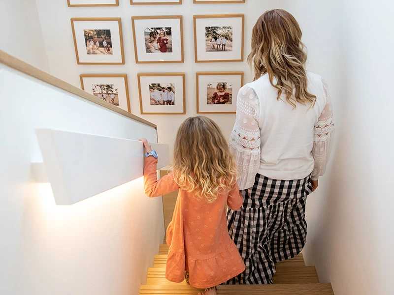 Mother and daughter going downstairs