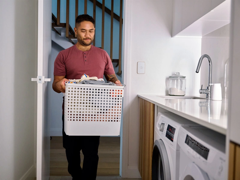 Man holding a laundry basket