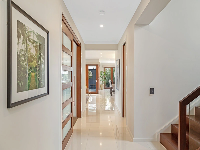 An elegant hallway leading to a dining room