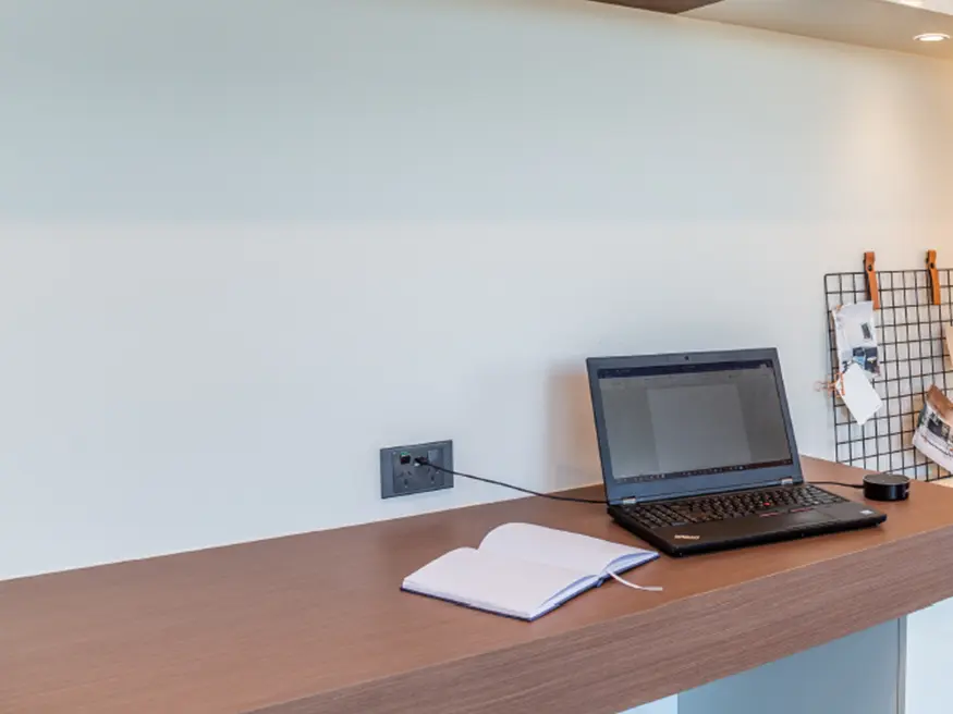 Laptop on wooden desk.