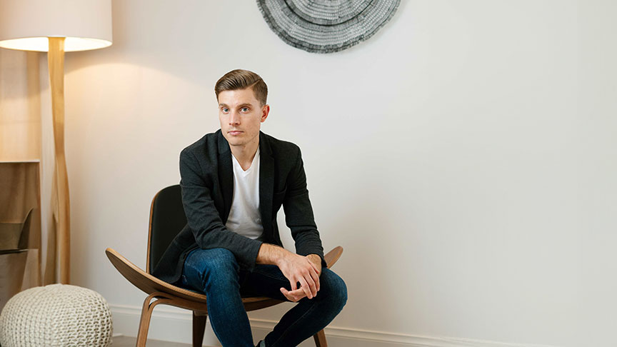 Tim Rochford sitting in a chair