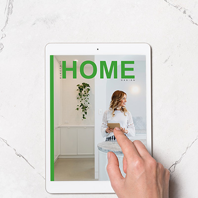 Smiling woman in elegant white dress holding an iPad