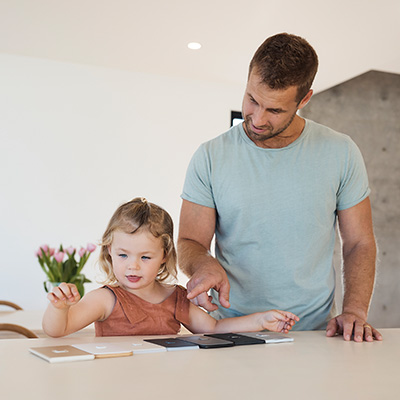 Dad and his daughter selecting Iconic switches.