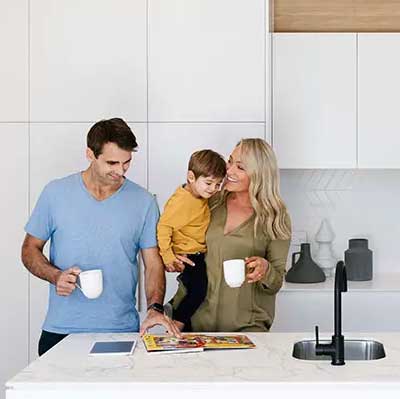 A family in a kitchen.