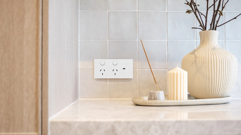 Matte white switch and a decoration on a kitchen countertop