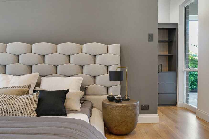 A modern bedroom featuring PDL Iconic Styl light switch